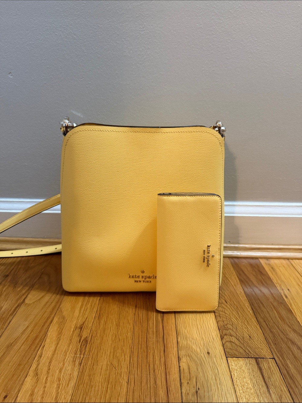 kate spade saffron yellow leather shoulder bag and matching wallet.